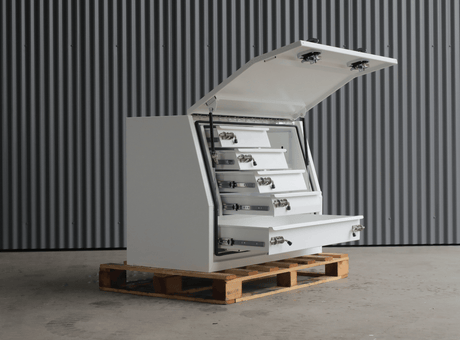 Australian Performance Boxes white 1200mm gullwing toolbox with five drawers, lid open and positioned on a pallet.