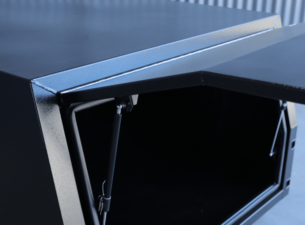 Close-up of apboxes 1200mm black jack-off gullwing canopy.