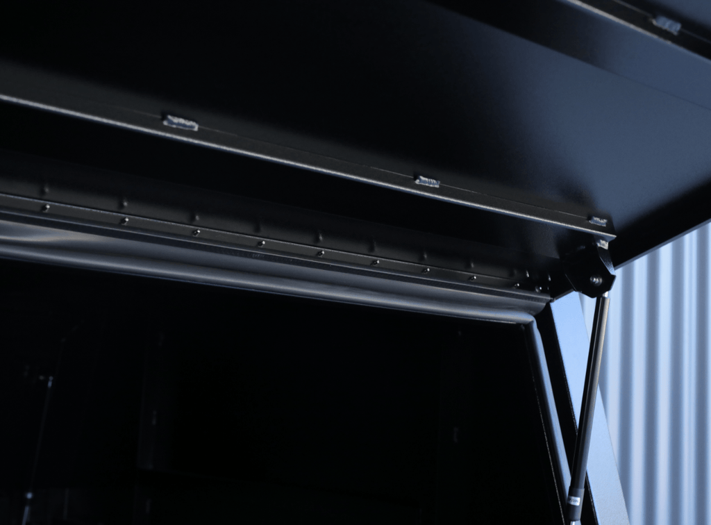 Interior shot of apboxes 1200mm black jack-off gullwing canopy, providing practical storage solutions.