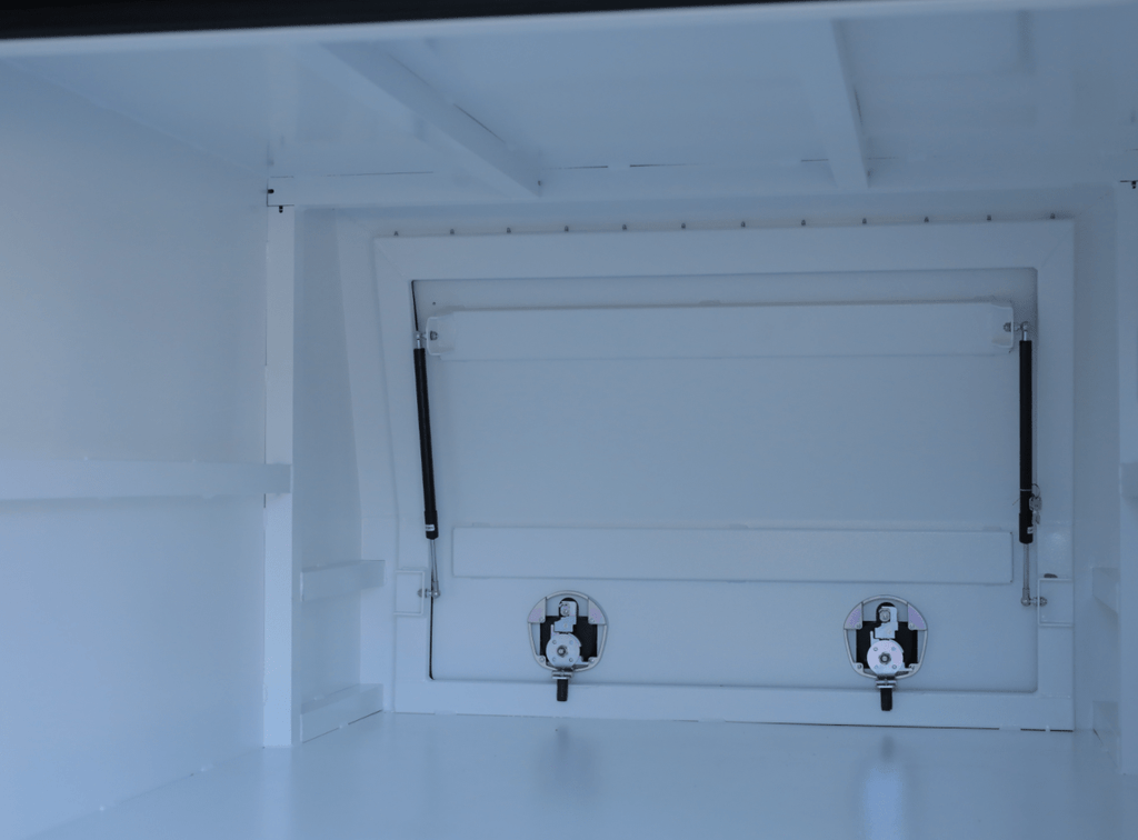 Interior view of apboxes 1200mm white jack-off gullwing canopy, offering ample space and accessibility.