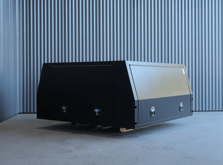 Apboxes 1800mm black 3-door jack-off gullwing canopy, ideal for heavy-duty vehicle storage and transport.