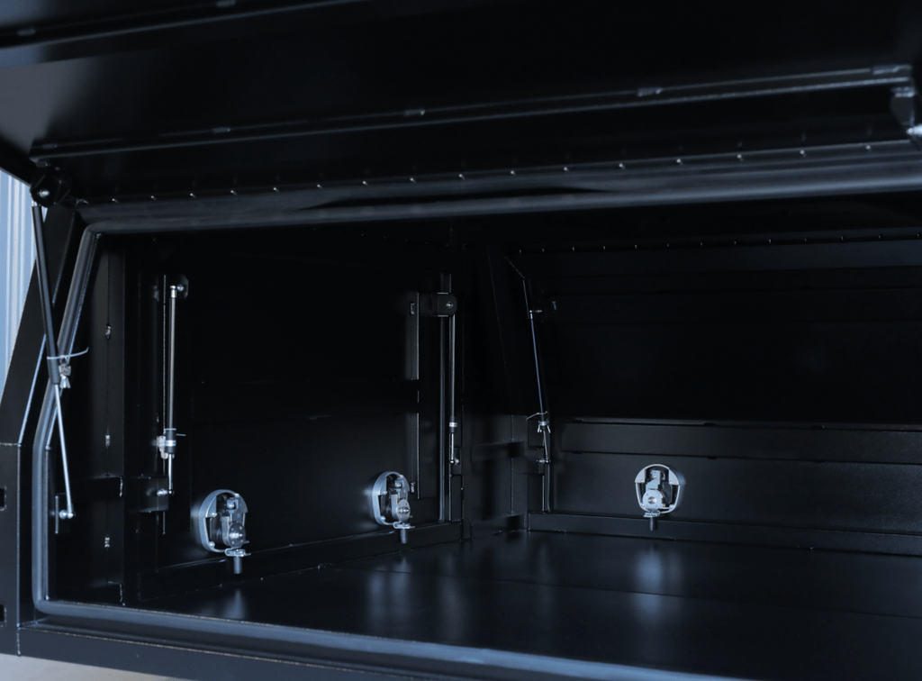 Front angle of apboxes 1800mm 3-door jack-off gullwing canopy in black for reliable and convenient access.