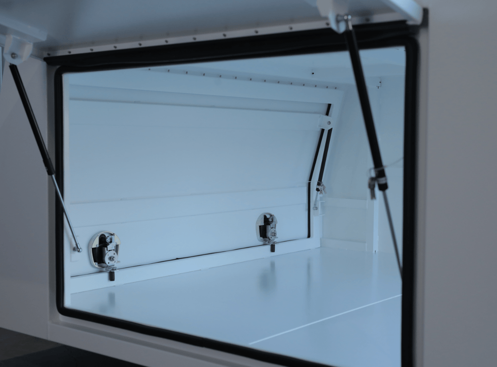 Angled shot of apboxes 1800mm 3-door white jack-off gullwing canopy, designed for secure storage and transport.