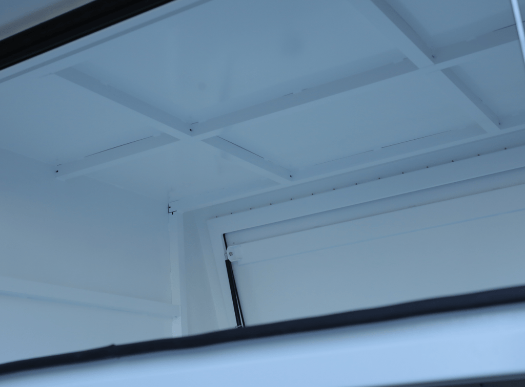 Interior detail of apboxes 1800mm white jack-off 3-door gullwing canopy, offering functional design.