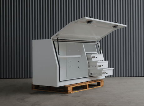 Apboxes 1800mm white 3-drawer gullwing toolbox, lid open and positioned on a pallet.