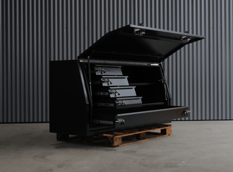 Apboxes 1800mm black 5-drawer gullwing toolbox, angled with door open, on display.
