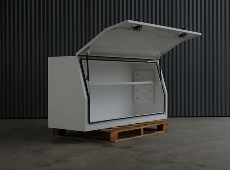 Apboxes 1800mm white aluminium gullwing toolbox with the door open, displayed on a pallet.