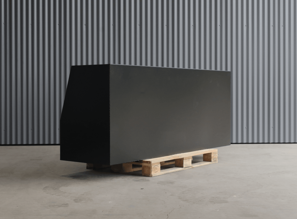 Apboxes 2100mm black 3-drawer gullwing toolbox, closed, sitting on a pallet in an industrial setting.