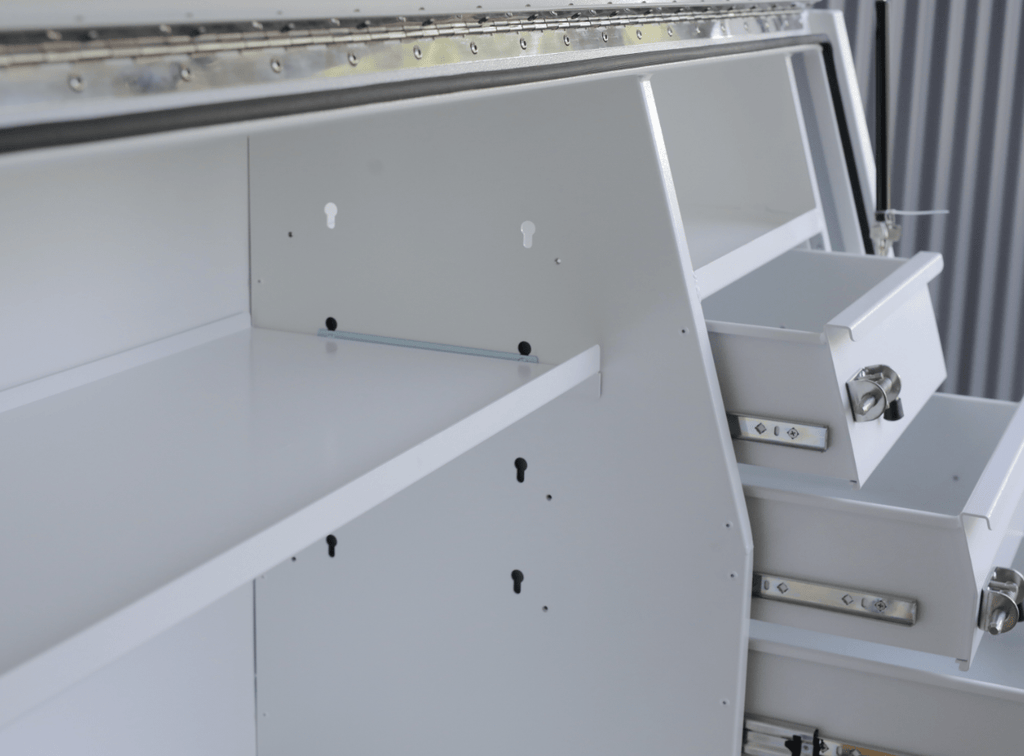 Interior view of apboxes 2100mm white 3-drawer gullwing toolbox, showing open compartments and drawers.