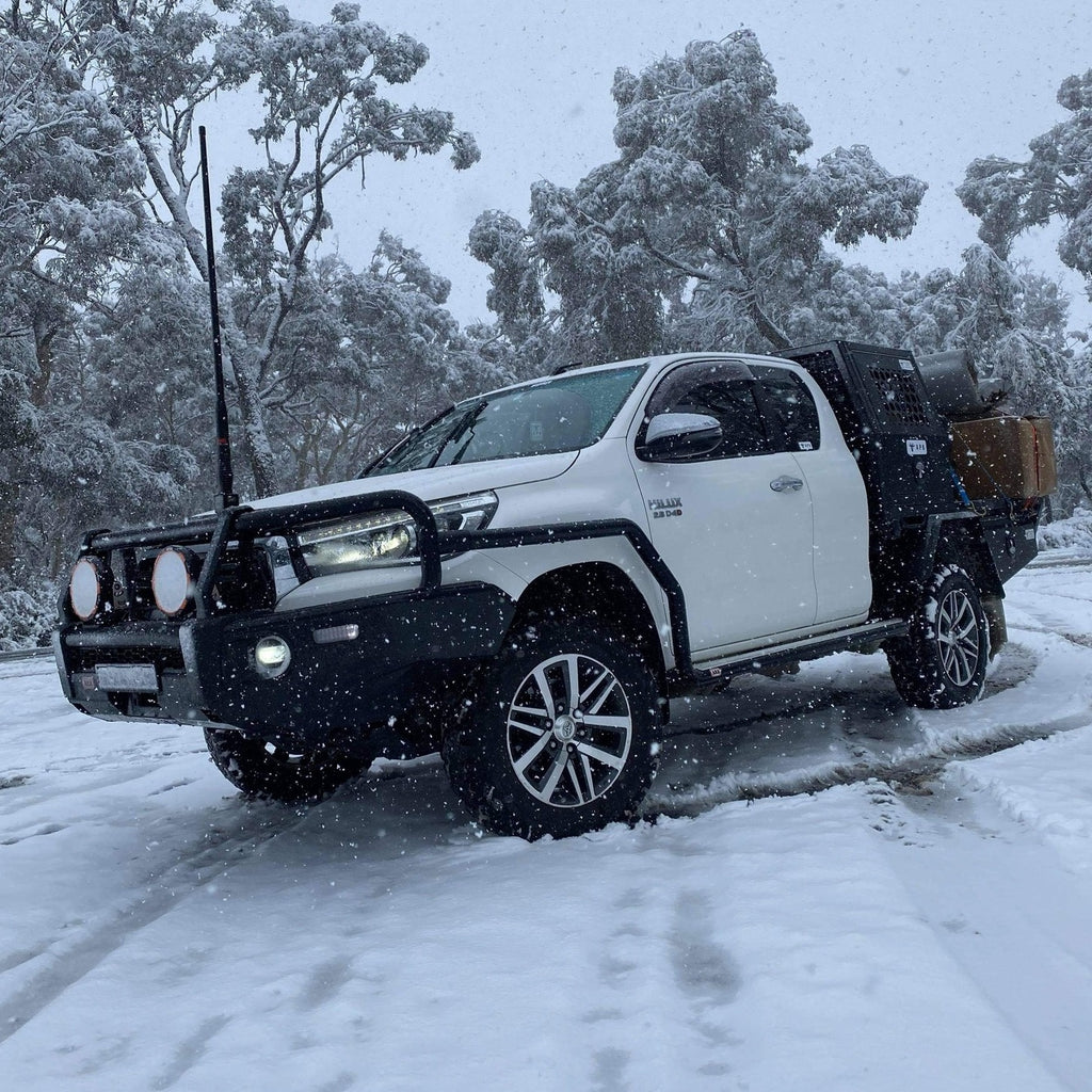 Utility vehicle fitted with ute canopy, side view showing canopy features




