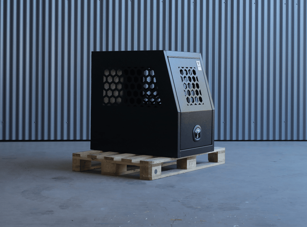 Front view of a black apb 600mm dog box for dogs.