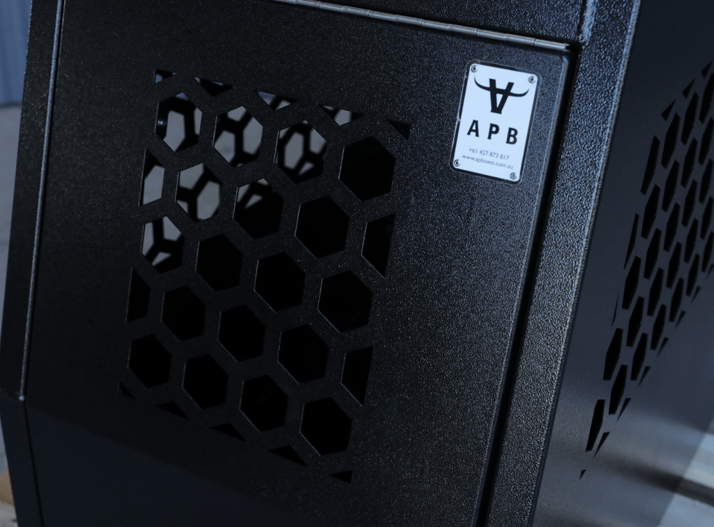 Detailed angled shot of a apb 600mm black dog transport box offering ample ventilation.