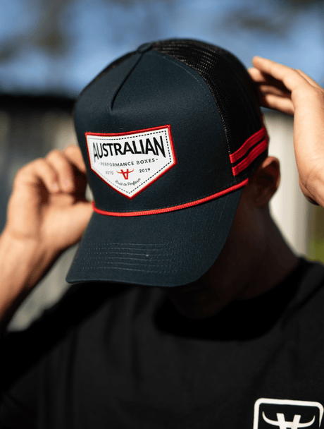 Man wearing the APBoxes Navy Trucker Hat