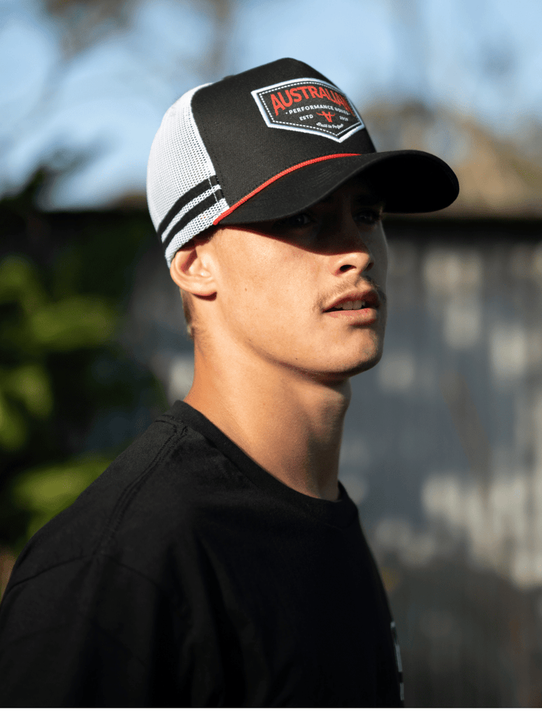 Man wearing the apboxes black trucker hat